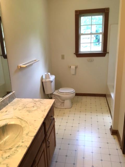 208 Independence Street Springfield, TN 37172 - Photo 13 of 22 a bathroom with a granite countertop sink and a toilet