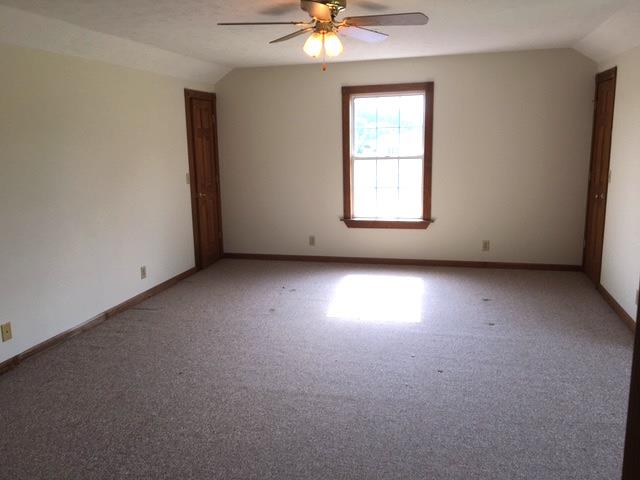 208 Independence Street Springfield, TN 37172 - Photo 16 of 22 an empty room with a window and a fan
