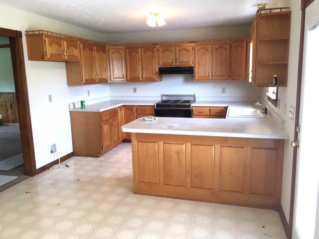 208 Independence Street Springfield, TN 37172 - Photo 7 of 22 a kitchen with stainless steel appliances granite countertop a sink stove and refrigerator