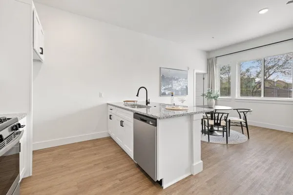 a kitchen with sink and cabinets