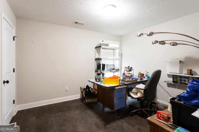 a view of a chairs and table in patio of the house