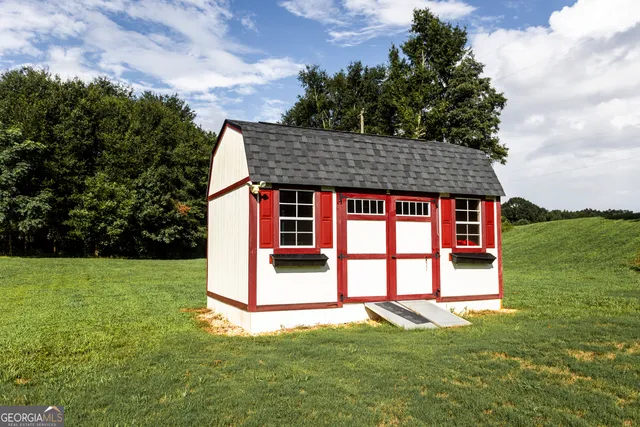a view of a backyard with swimming pool