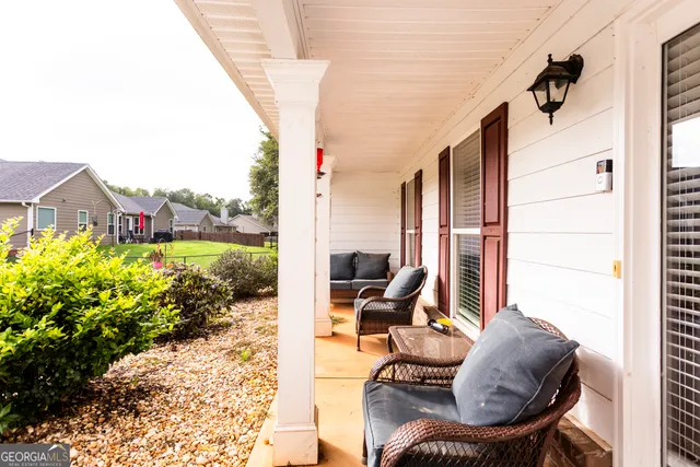 a view of balcony with patio
