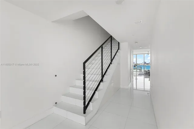 a view of a swimming pool with two chairs