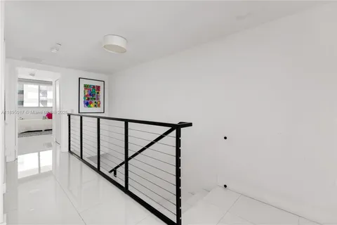 a view of building and yard with car parked