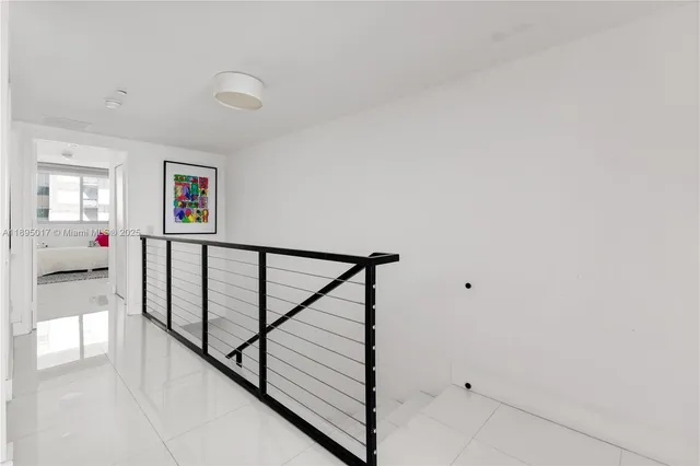 a view of building and yard with car parked