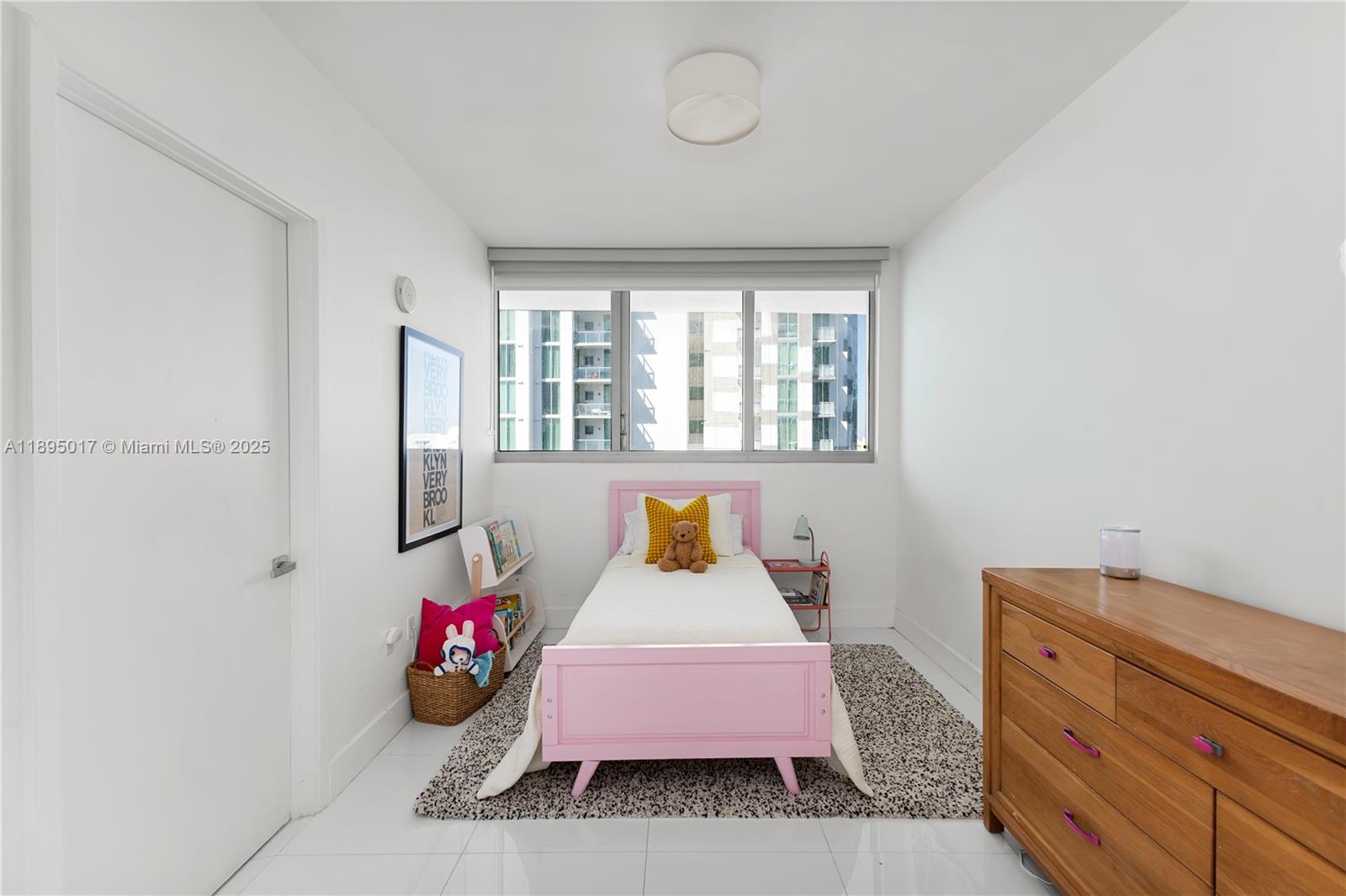 7935 East Drive, Unit 803 Miami Beach, FL 33141 - Photo 22 of 77 a bedroom with a bed and wooden floor