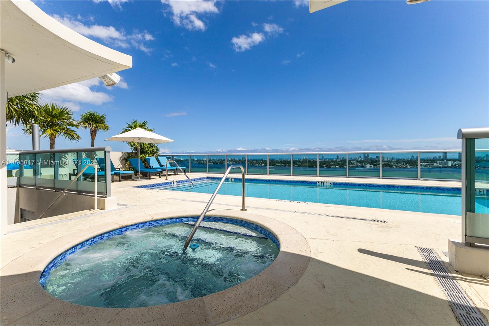 7935 East Drive, Unit 803 Miami Beach, FL 33141 - Photo 31 of 77 a view of a swimming pool with a patio