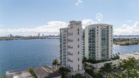 a bedroom with a bed and a view of bathroom
