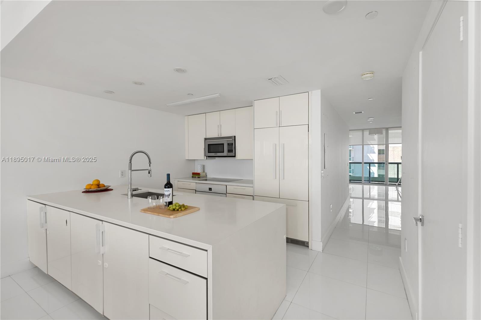 7935 East Drive, Unit 803 Miami Beach, FL 33141 - Photo 10 of 77 a kitchen with appliances a cabinets and a counter top space