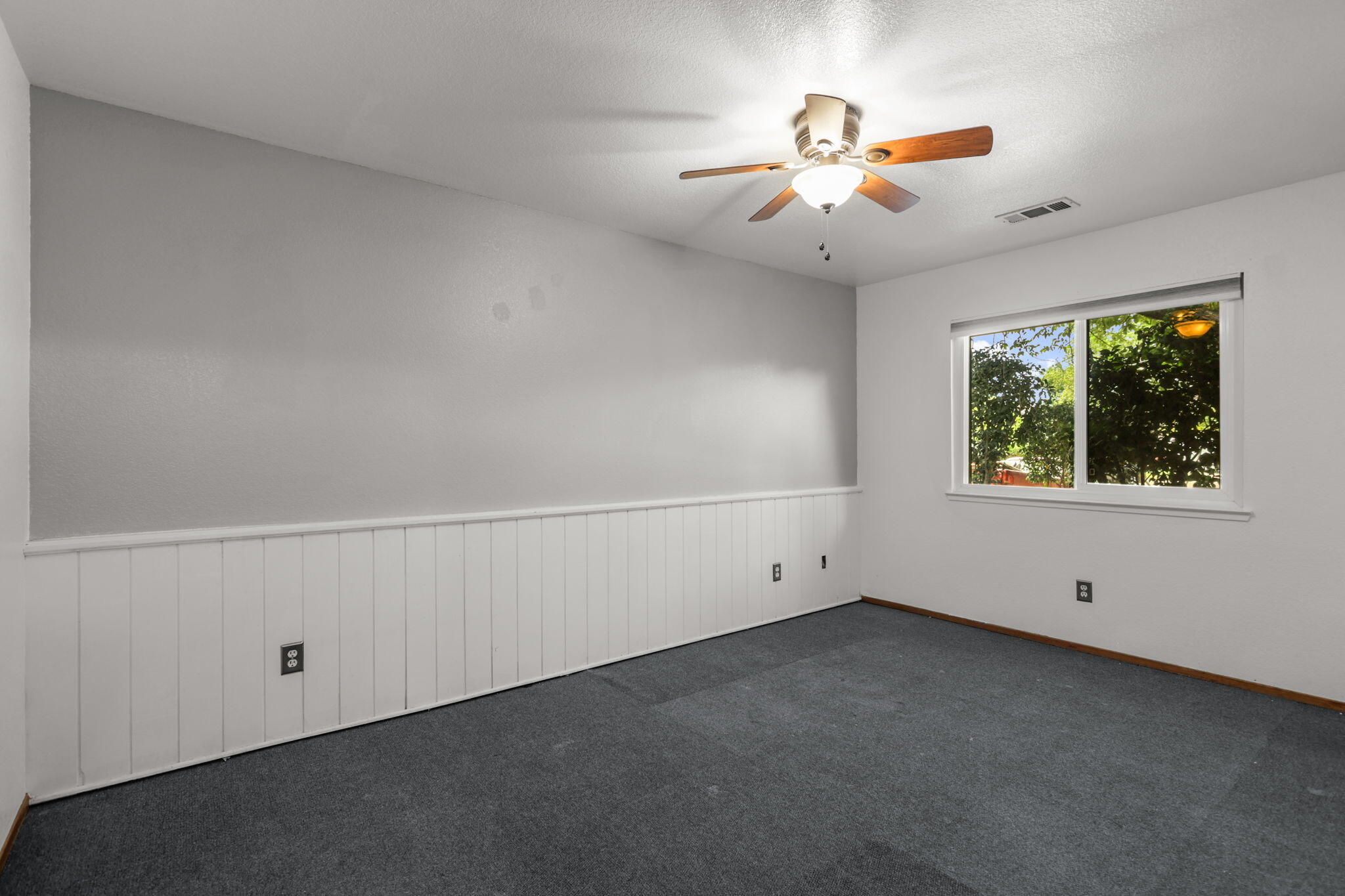 3985 Cirrus Street Redding, CA 96002 - Photo 13 of 27 an empty room with fan and windows