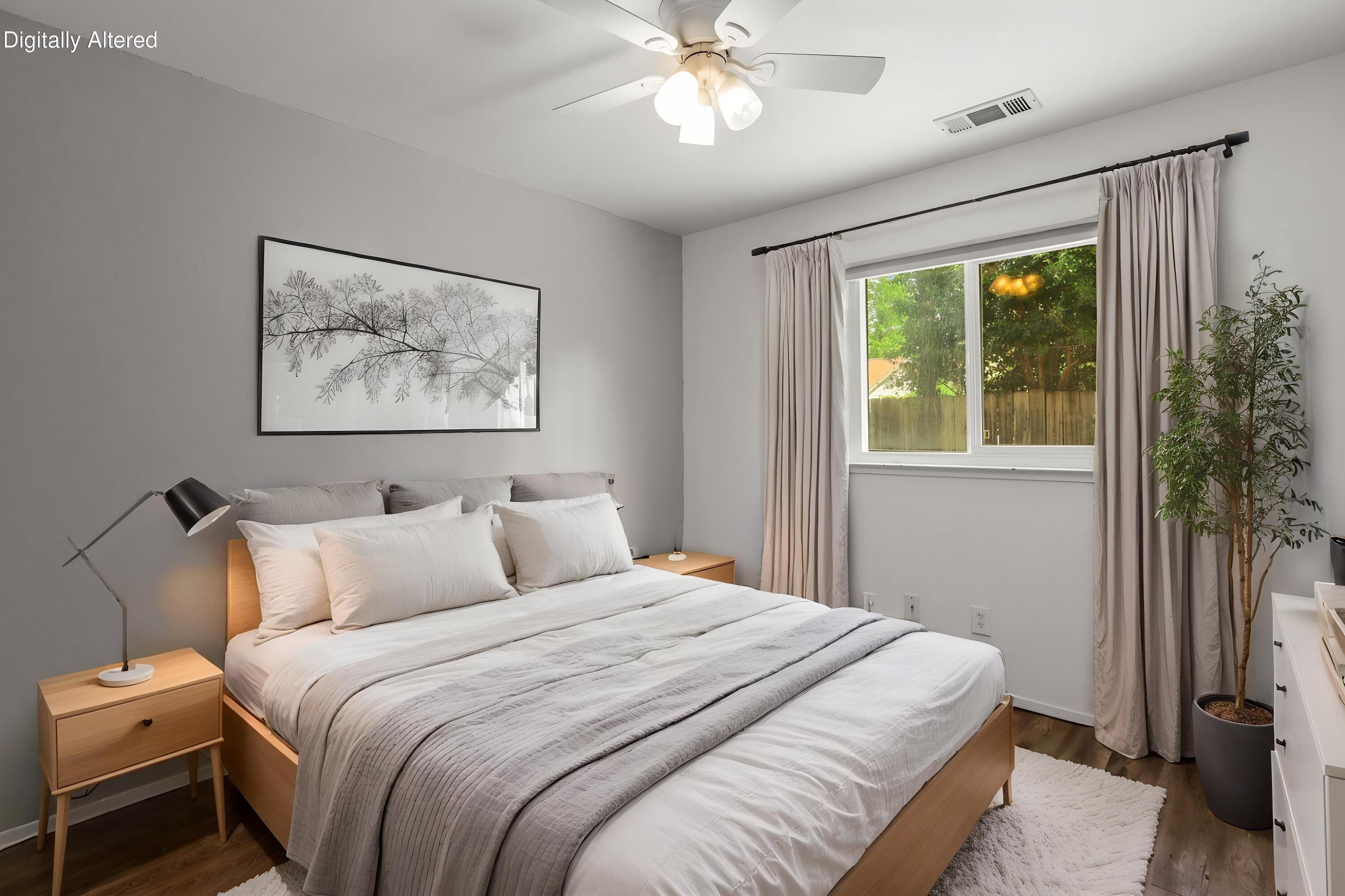 3985 Cirrus Street Redding, CA 96002 - Photo 14 of 27 a bedroom with a large bed and a window
