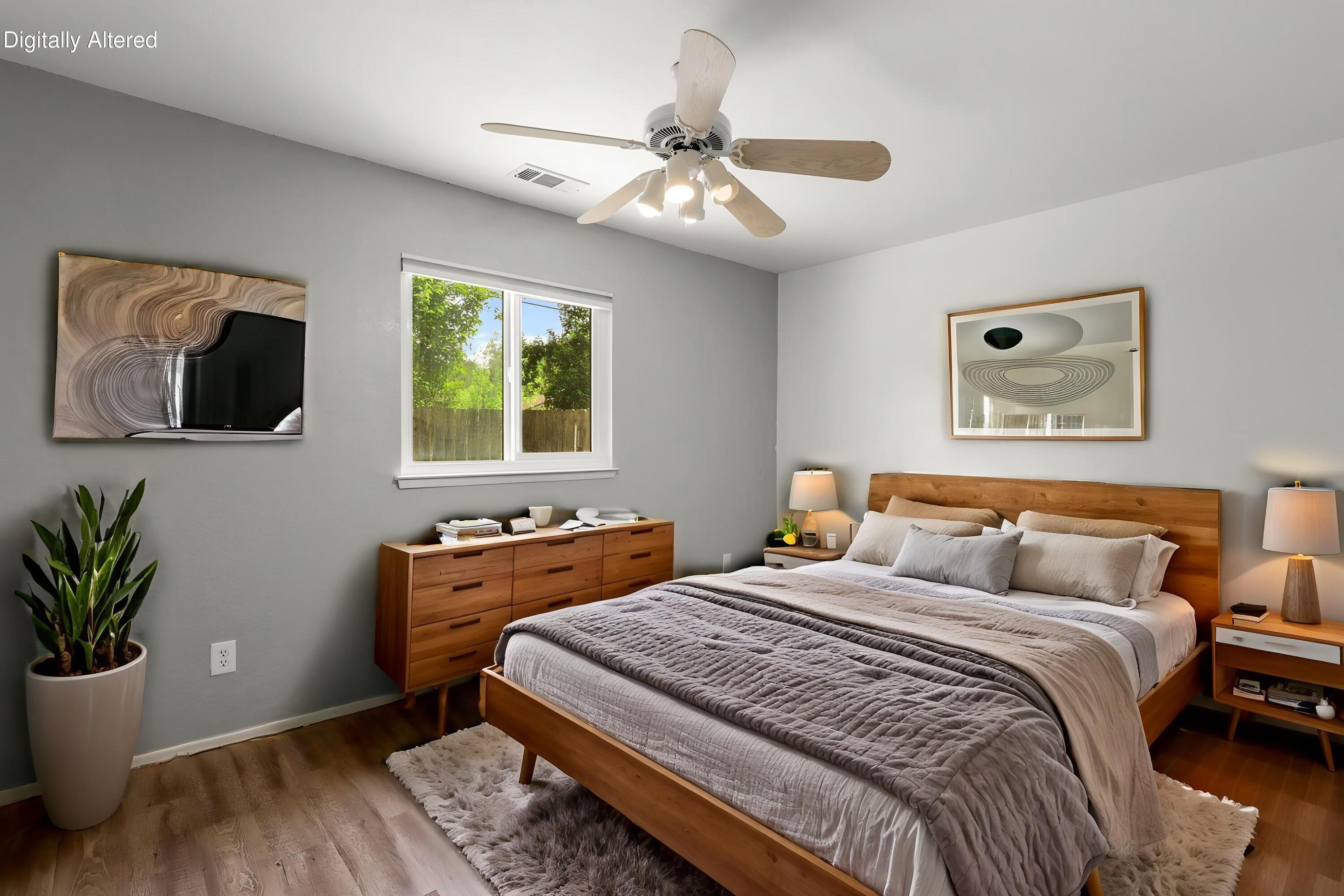 3985 Cirrus Street Redding, CA 96002 - Photo 16 of 27 a bedroom with a large bed and a window
