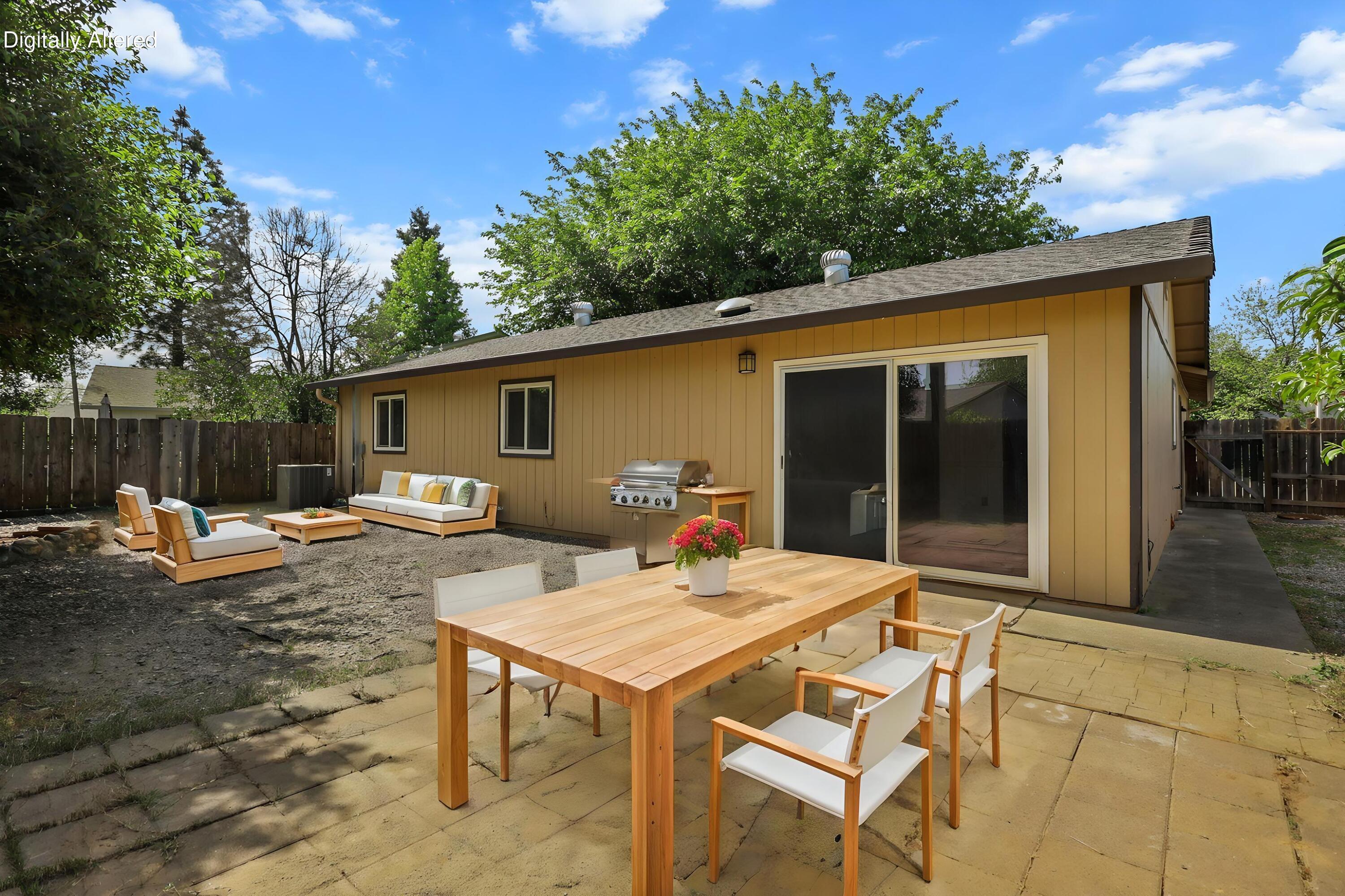 3985 Cirrus Street Redding, CA 96002 - Photo 22 of 27 a view of backyard of house with seating space