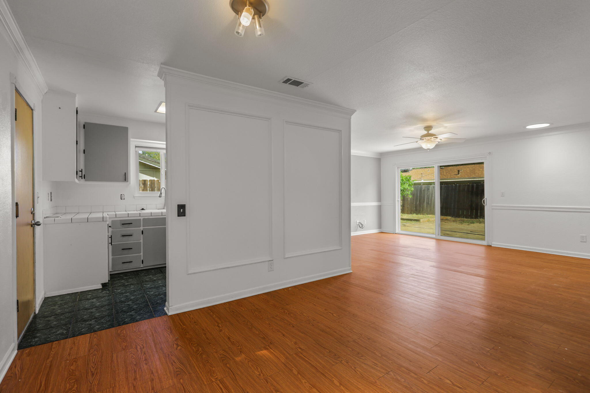 3985 Cirrus Street Redding, CA 96002 - Photo 6 of 27 wooden floor in an empty room with a window