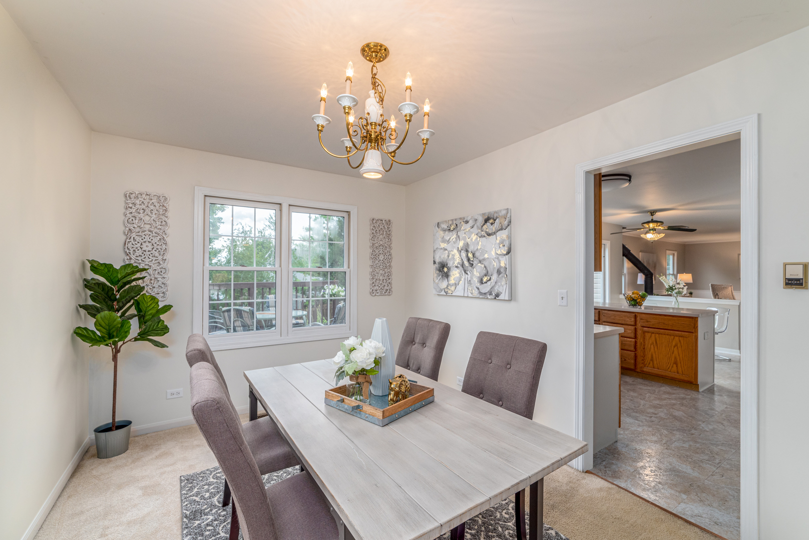 2809 Weld Road Elgin, IL 60124 - Photo 15 of 28 a living room with furniture and a chandelier