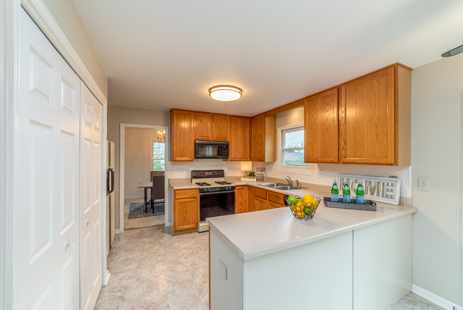 2809 Weld Road Elgin, IL 60124 - Photo 4 of 28 a kitchen with a sink a stove and cabinets