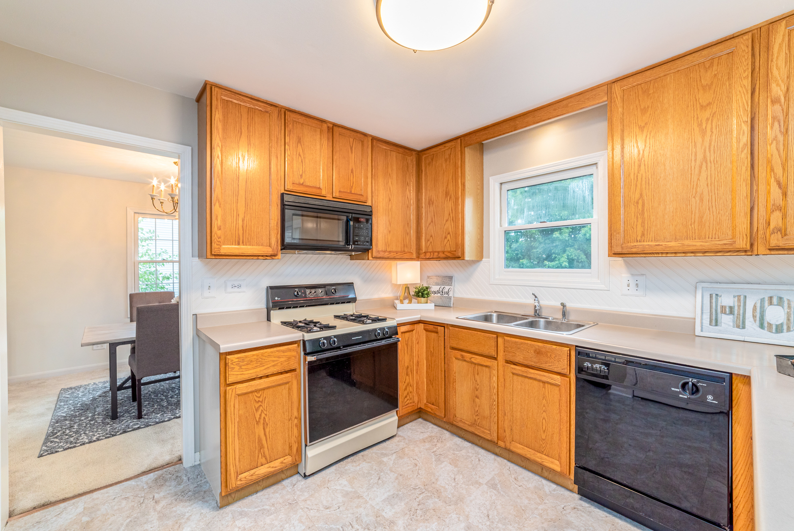 2809 Weld Road Elgin, IL 60124 - Photo 5 of 28 a kitchen with stainless steel appliances granite countertop a sink stove and cabinets