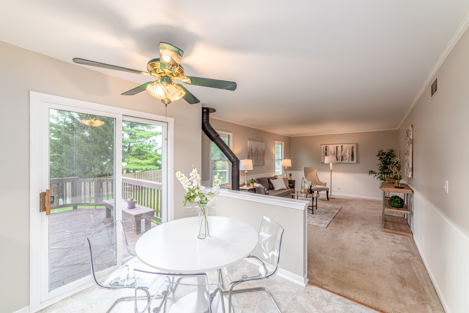 2809 Weld Road Elgin, IL 60124 - Photo 8 of 28 a dining room with chandelier fan and wooden floor