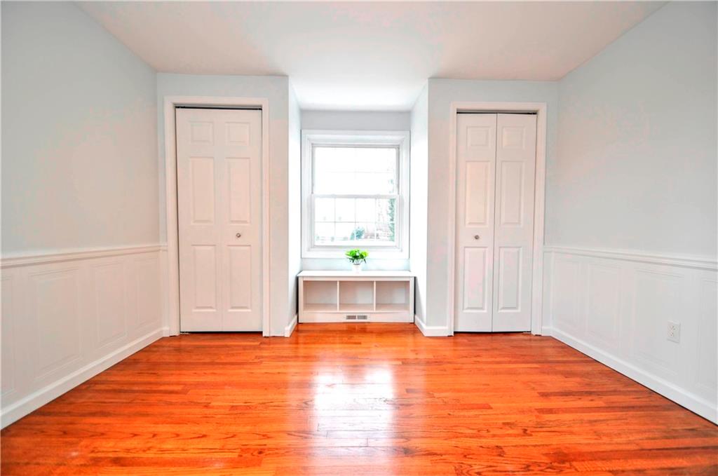 1313 Star Ridge Drive Pittsburgh, PA 15241 - Photo 24 of 36 an empty room with a fireplace and wooden floor