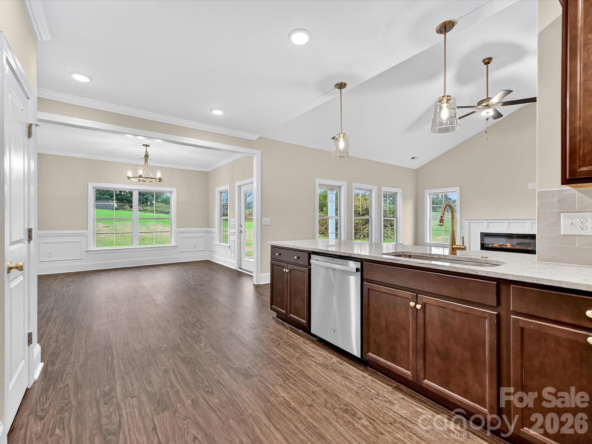 3030 Buffett Lane, Unit 49 Monroe, NC 28110 - Photo 11 of 31 a view of a kitchen with a sink and wooden floor