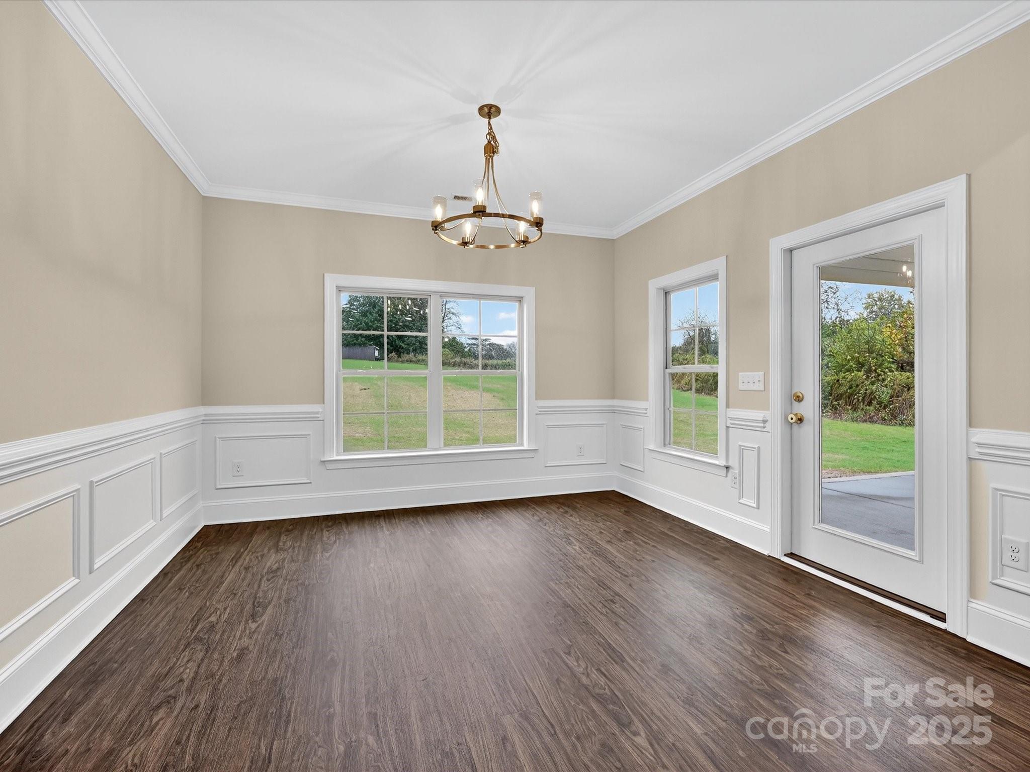 3030 Buffett Lane, Unit 49 Monroe, NC 28110 - Photo 11 of 27 a view of wooden floor and windows in a room