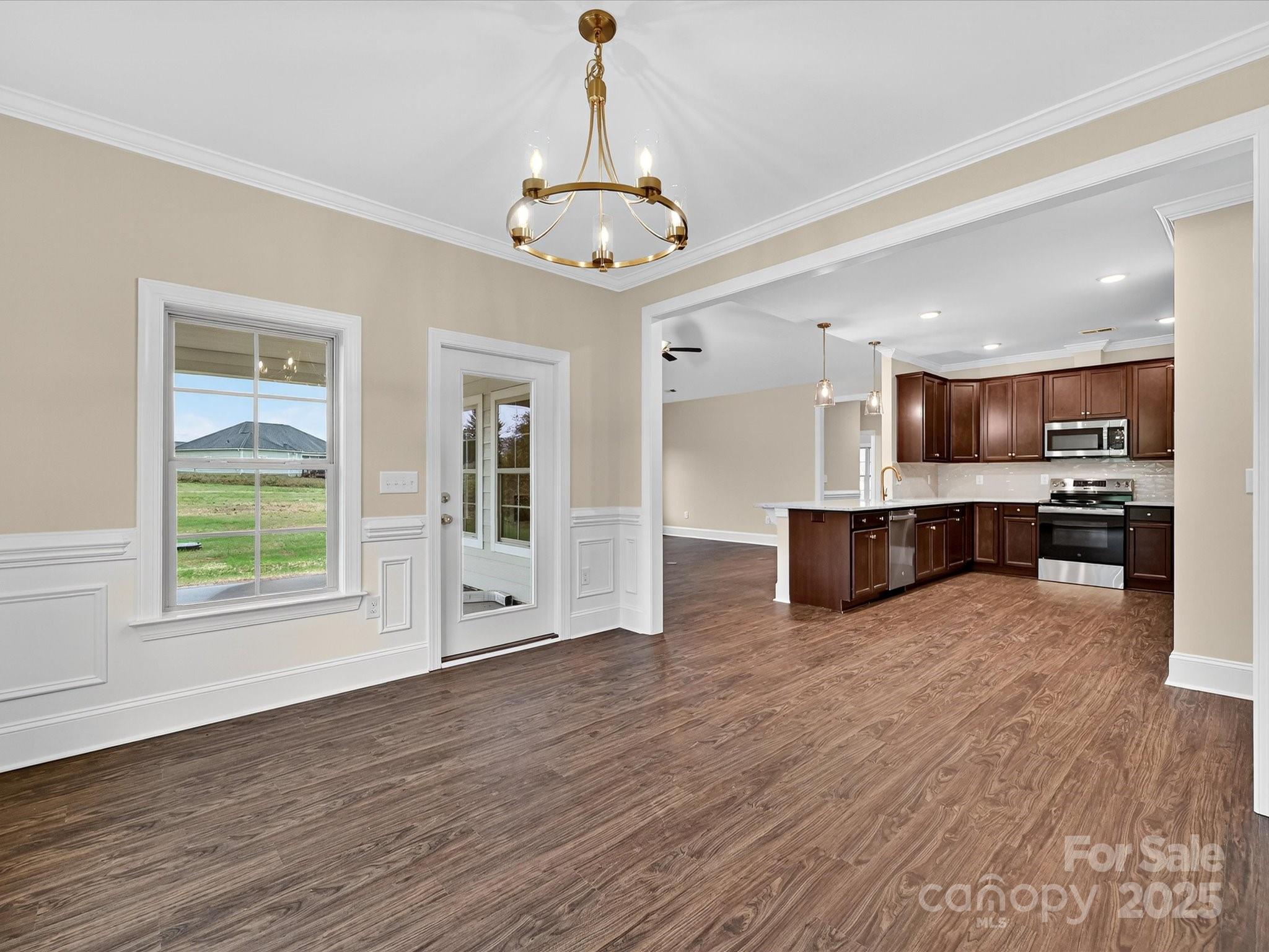 3030 Buffett Lane, Unit 49 Monroe, NC 28110 - Photo 12 of 27 a view of kitchen with wooden floor and windows