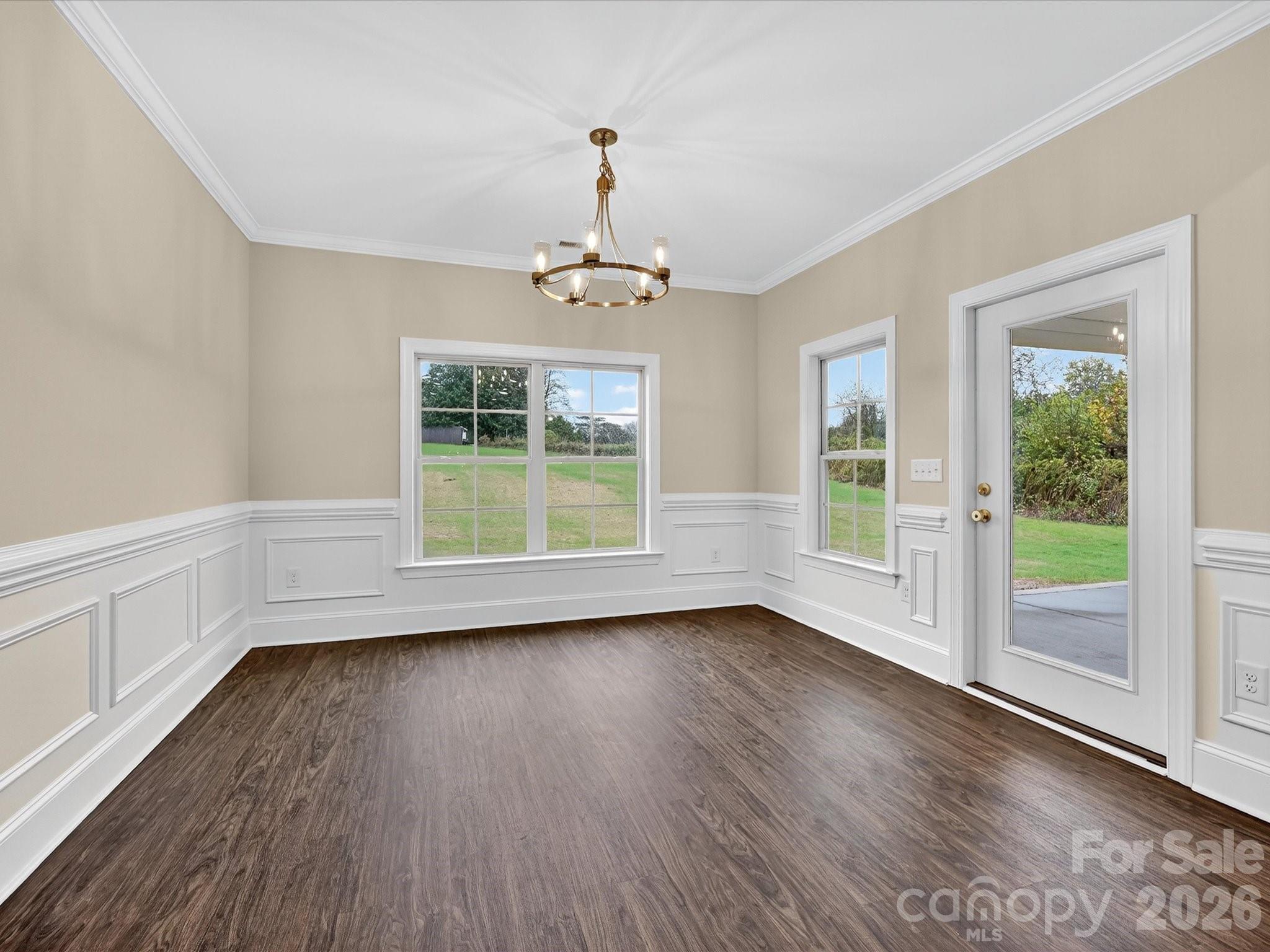 3030 Buffett Lane, Unit 49 Monroe, NC 28110 - Photo 12 of 31 a view of wooden floor and windows in a room