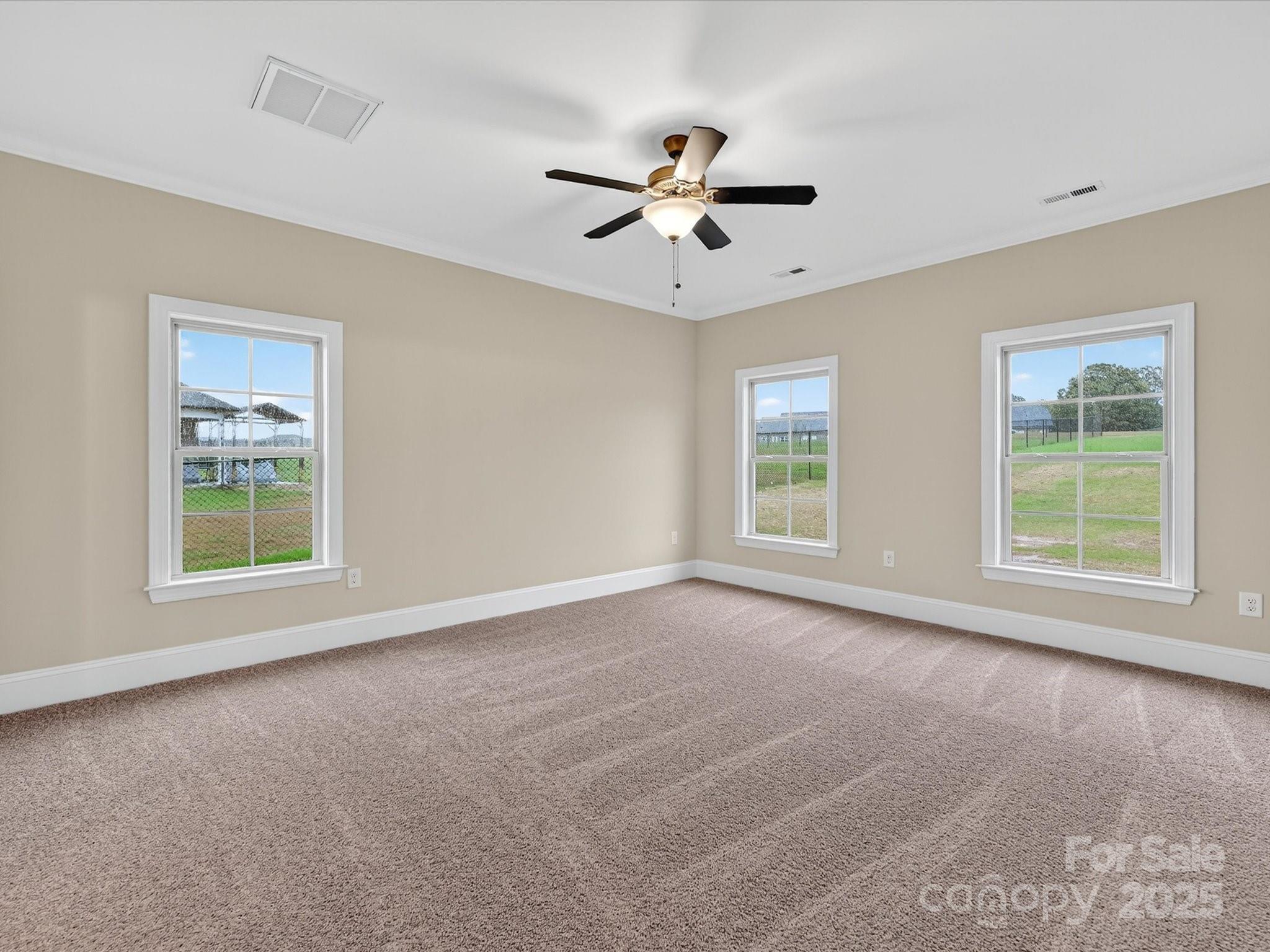 3030 Buffett Lane, Unit 49 Monroe, NC 28110 - Photo 13 of 27 a view of a livingroom with a window and a ceiling fan