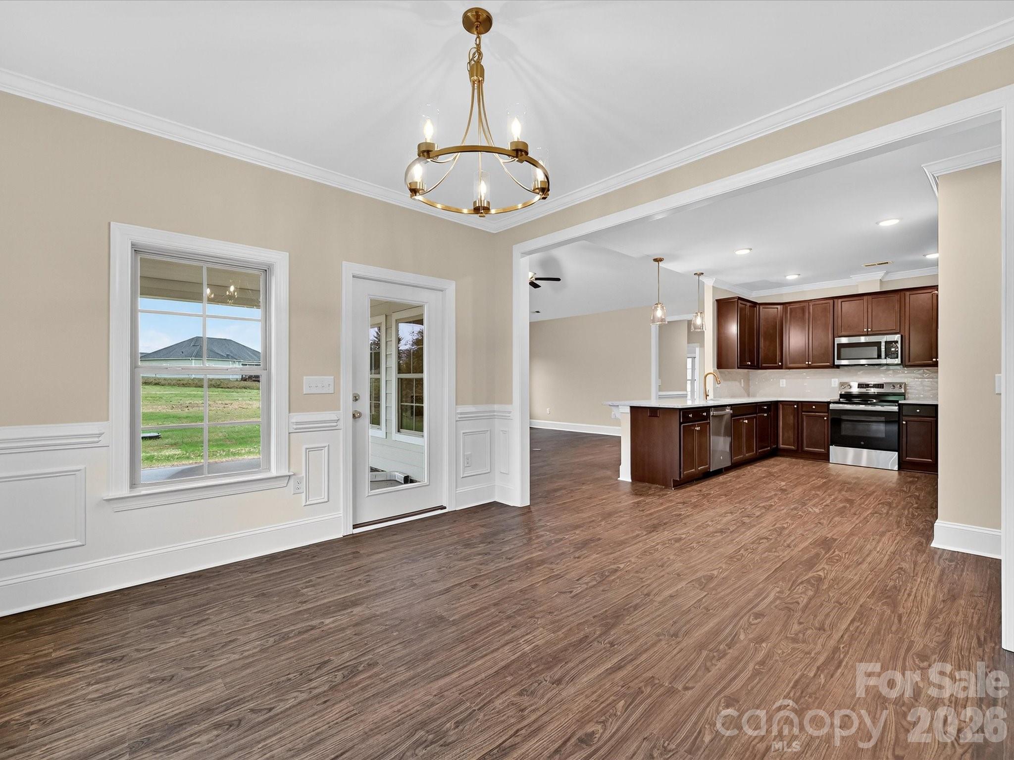 3030 Buffett Lane, Unit 49 Monroe, NC 28110 - Photo 14 of 31 a view of kitchen with wooden floor and windows