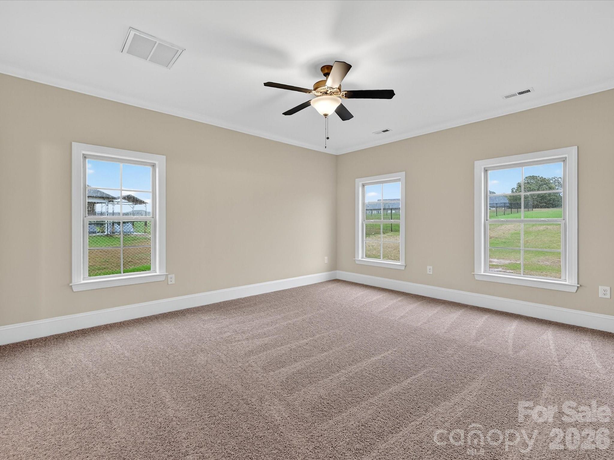 3030 Buffett Lane, Unit 49 Monroe, NC 28110 - Photo 15 of 31 a view of a livingroom with a window and a ceiling fan