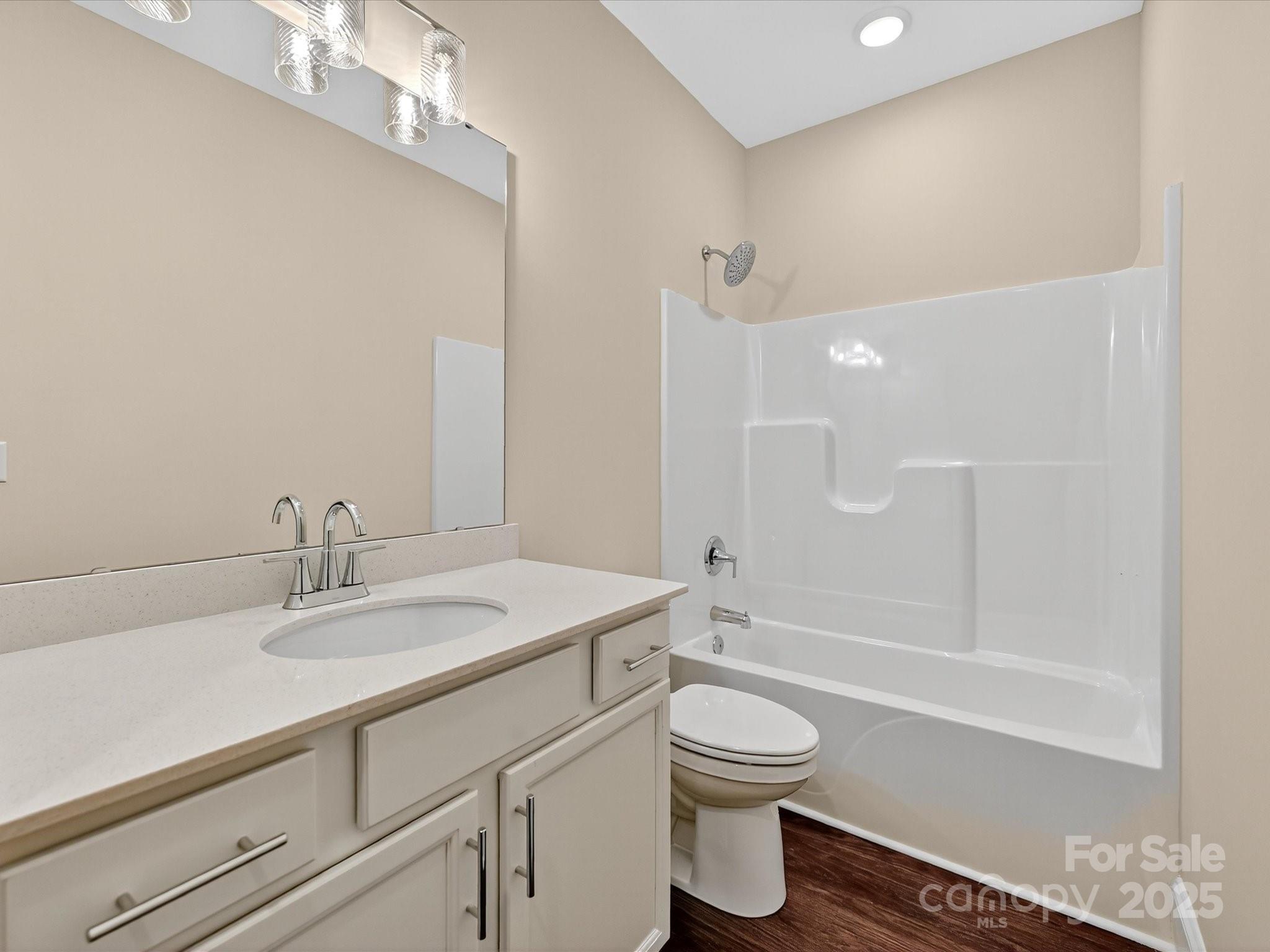 3030 Buffett Lane, Unit 49 Monroe, NC 28110 - Photo 19 of 27 a bathroom with a sink a toilet and shower