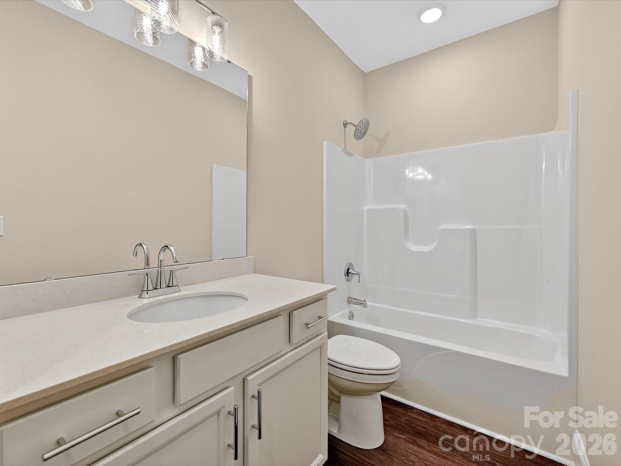 3030 Buffett Lane, Unit 49 Monroe, NC 28110 - Photo 22 of 31 a bathroom with a sink a toilet and shower