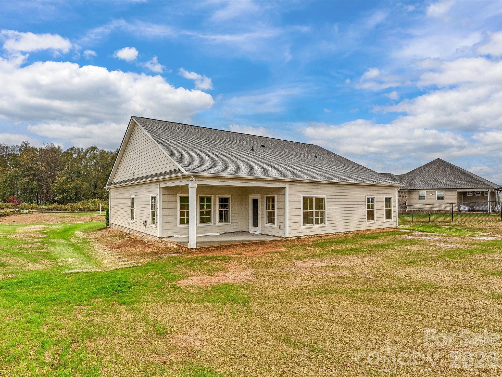 3030 Buffett Lane, Unit 49 Monroe, NC 28110 - Photo 26 of 31 a front view of house with yard and green space