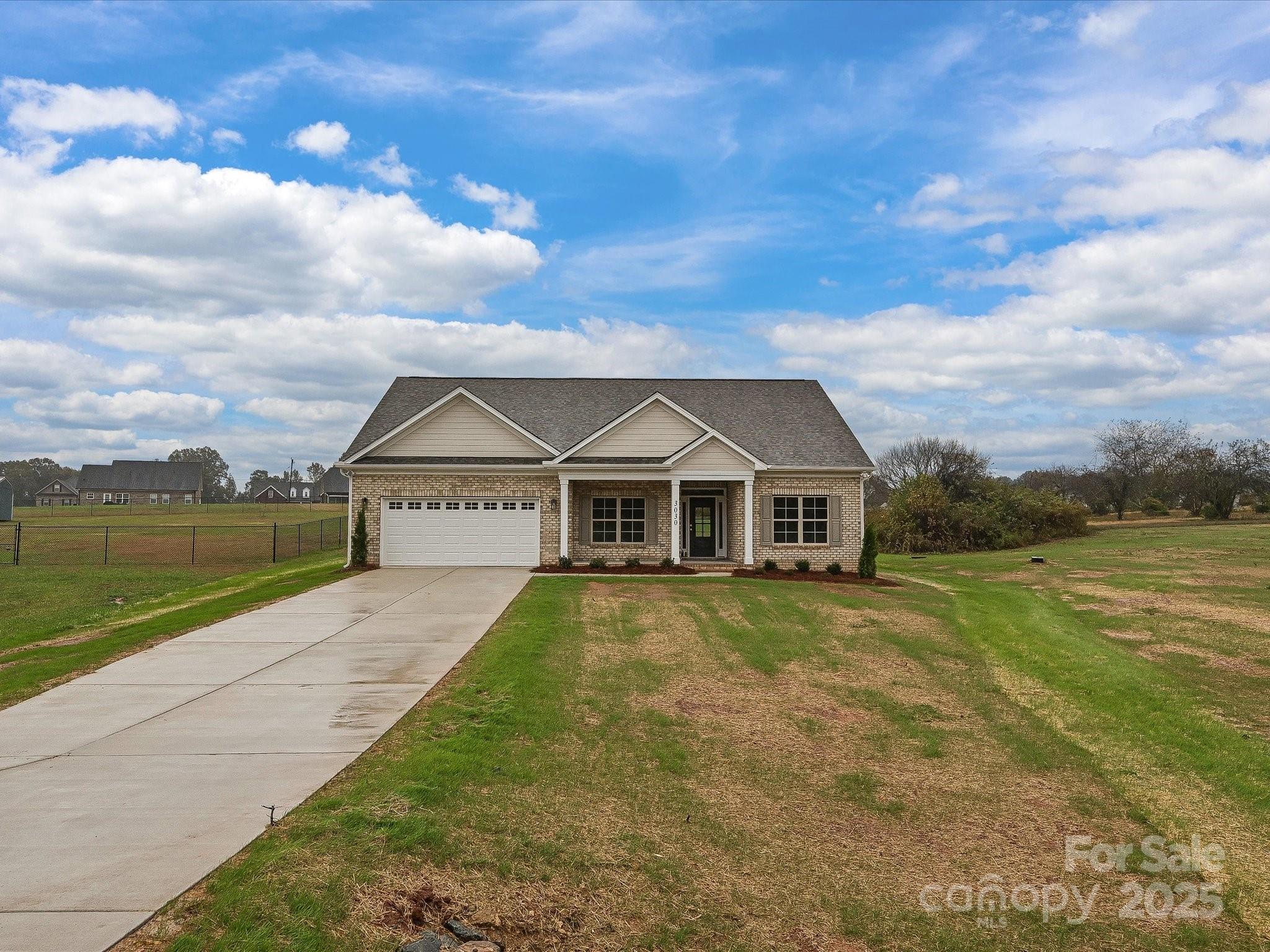 3030 Buffett Lane, Unit 49 Monroe, NC 28110 - Photo 27 of 27 a front view of a house with a yard