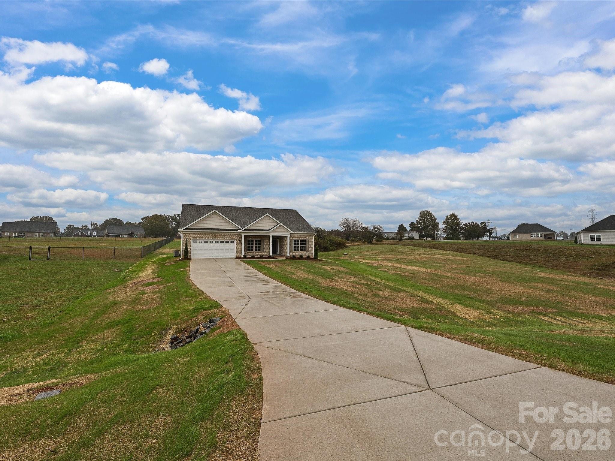 3030 Buffett Lane, Unit 49 Monroe, NC 28110 - Photo 30 of 31 a view of a house with a yard