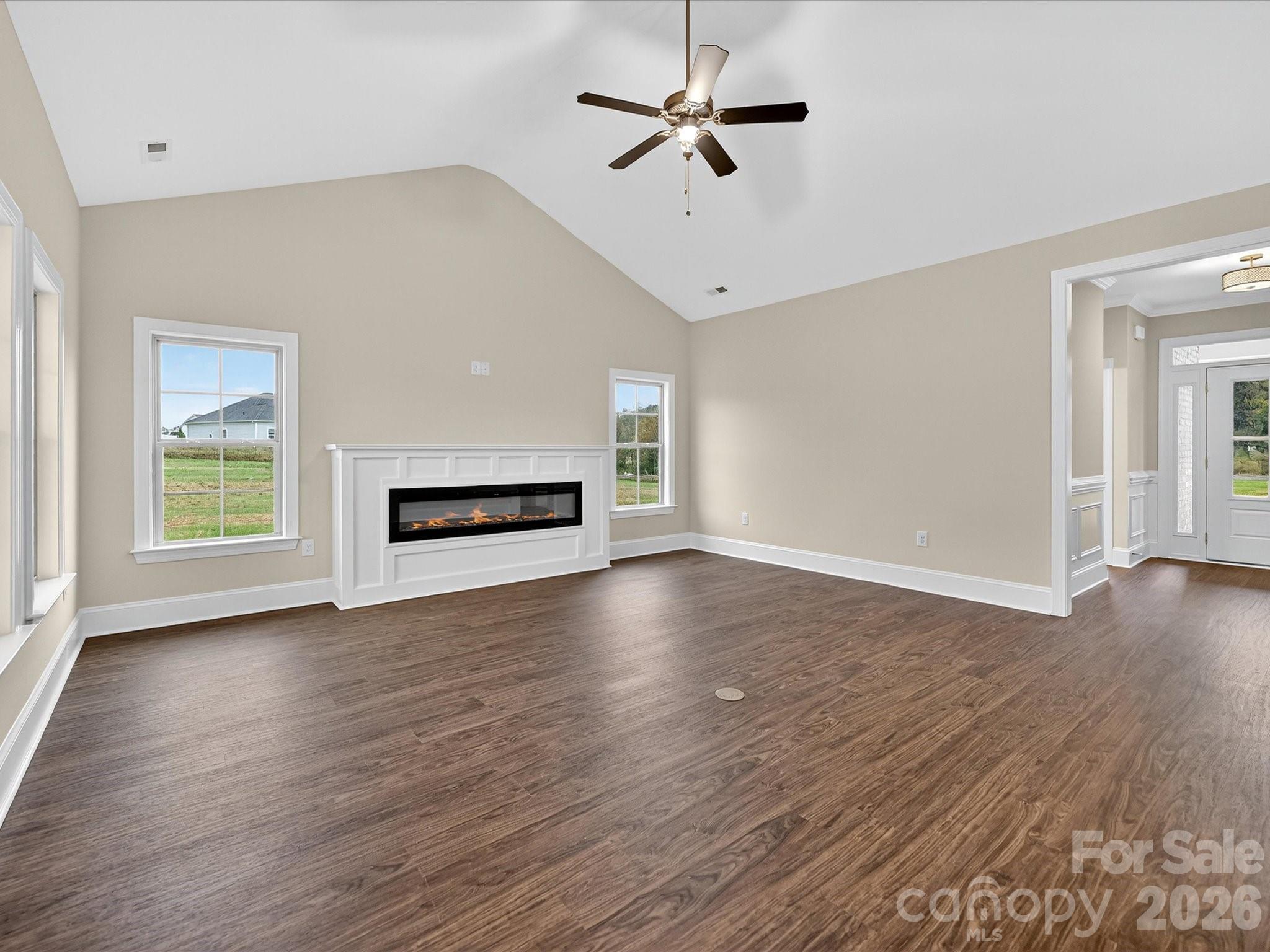 3030 Buffett Lane, Unit 49 Monroe, NC 28110 - Photo 4 of 31 a view of room with hardwood floor and ceiling fan