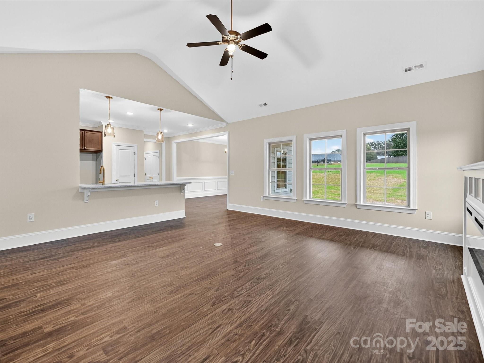 3030 Buffett Lane, Unit 49 Monroe, NC 28110 - Photo 5 of 27 a view of an empty room with window and wooden floor