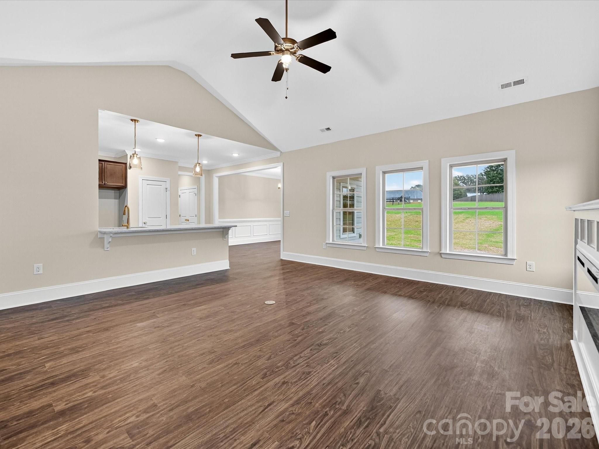 3030 Buffett Lane, Unit 49 Monroe, NC 28110 - Photo 6 of 31 a view of an empty room with window and wooden floor