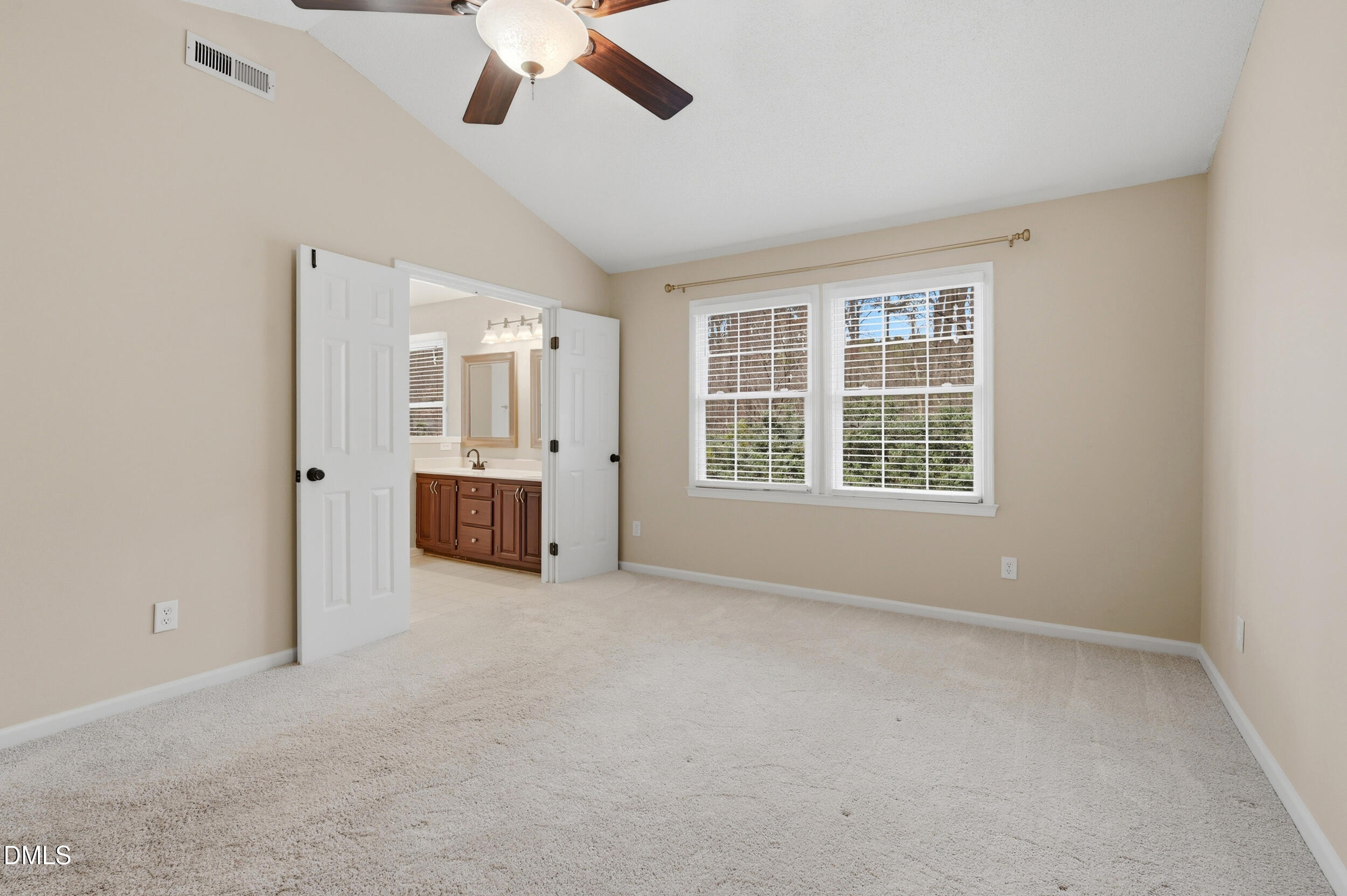 1713 Tealwood Place Raleigh, NC 27615 - Photo 12 of 26 an empty room with windows and cabinet area