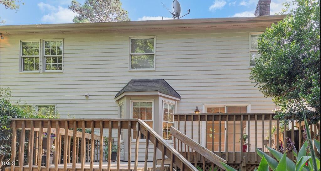 1713 Tealwood Place Raleigh, NC 27615 - Photo 23 of 26 a view of a house with wooden deck