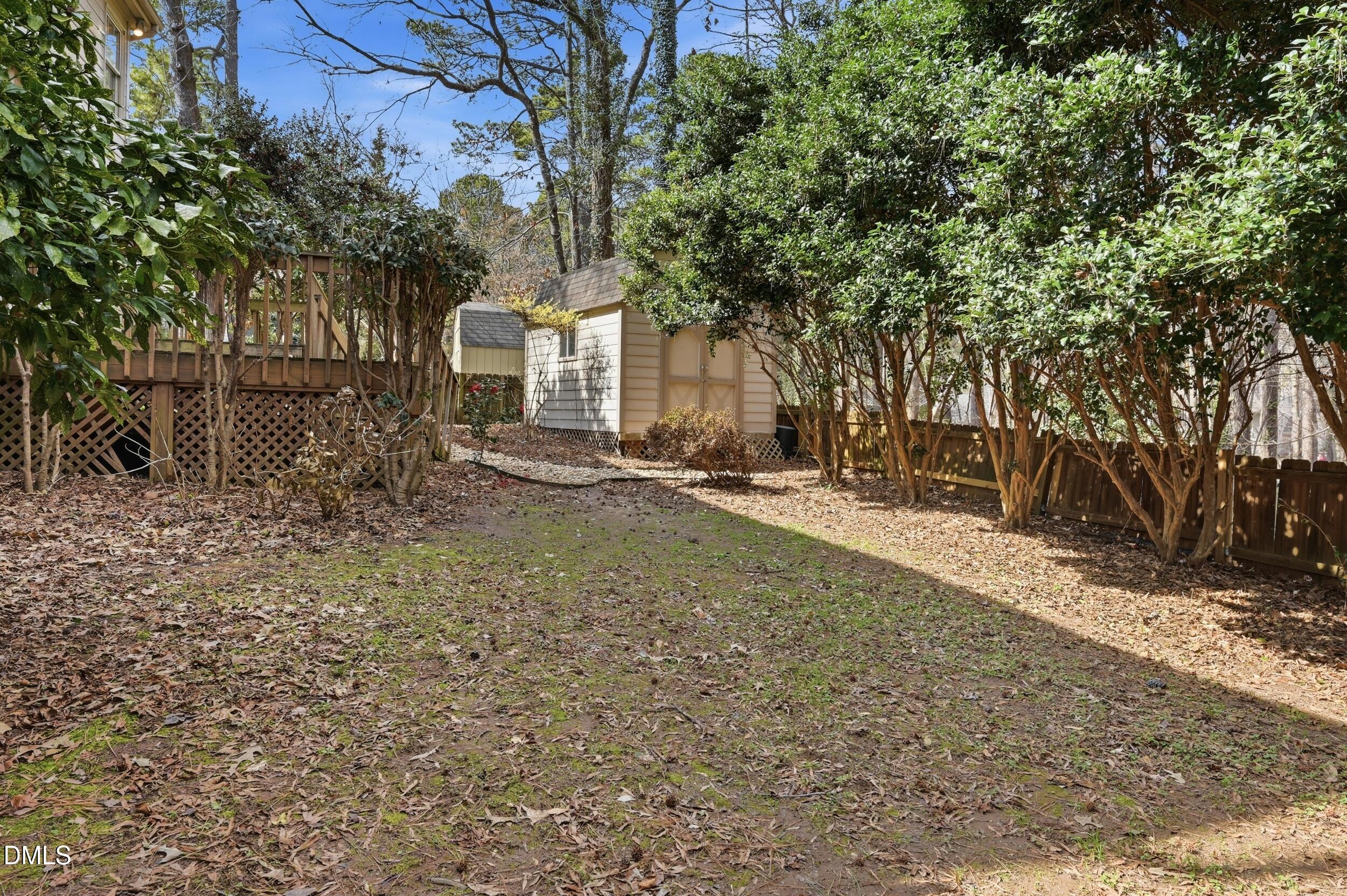 1713 Tealwood Place Raleigh, NC 27615 - Photo 24 of 26 a front view of a house with a yard