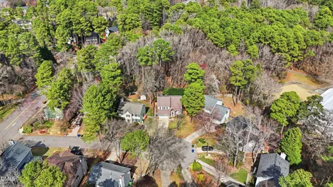 an aerial view of a residential houses with outdoor space