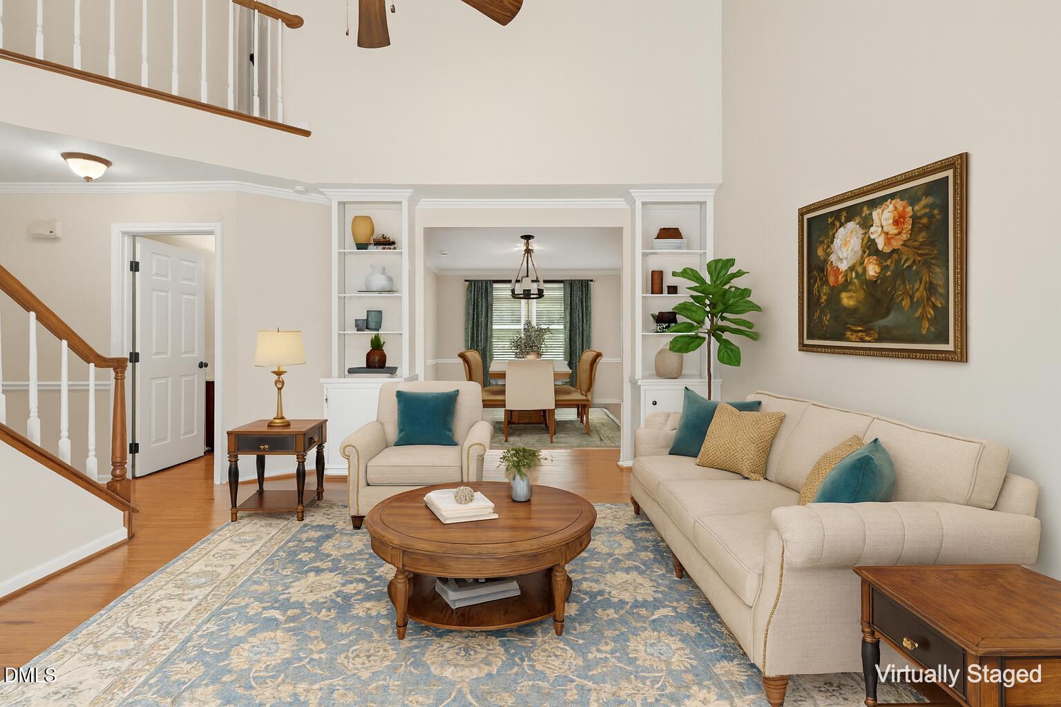 1713 Tealwood Place Raleigh, NC 27615 - Photo 5 of 26 a living room with furniture and a potted plant