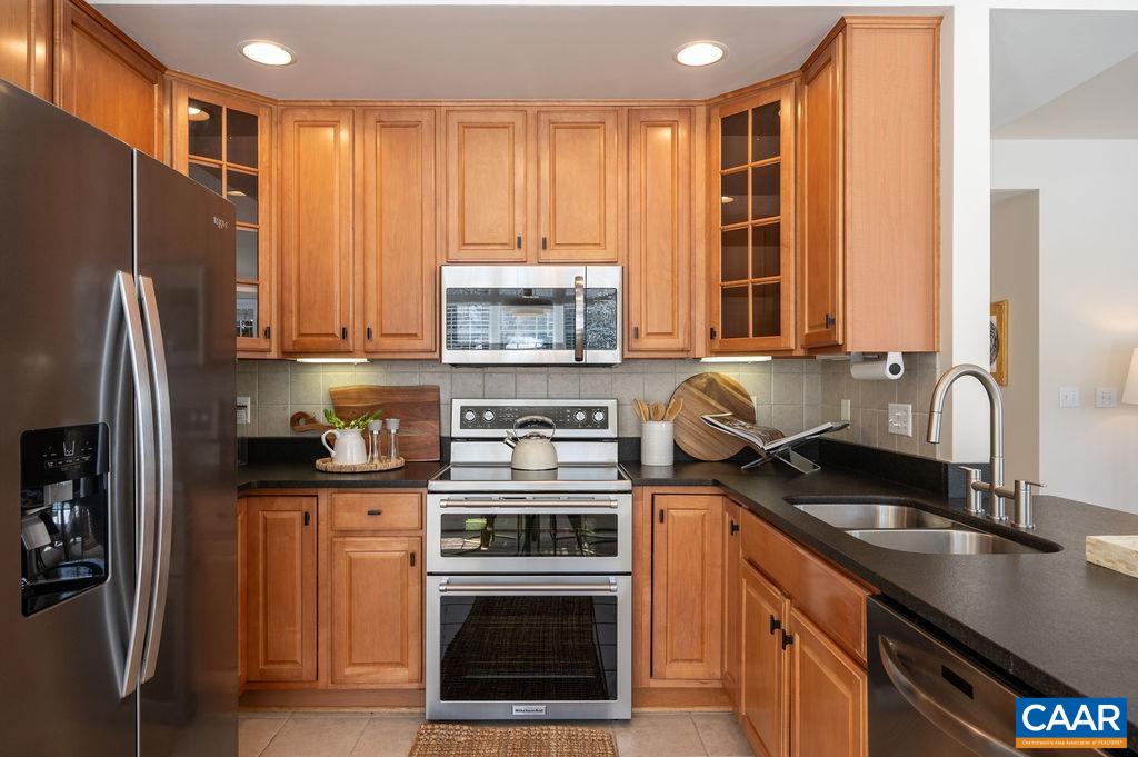 732 Russet Road Crozet, VA 22932 - Photo 13 of 48 a kitchen with stainless steel appliances granite countertop a sink stove and refrigerator