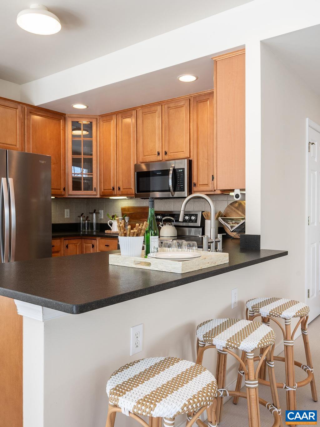 732 Russet Road Crozet, VA 22932 - Photo 14 of 48 a kitchen with stainless steel appliances granite countertop a sink a stove and a refrigerator