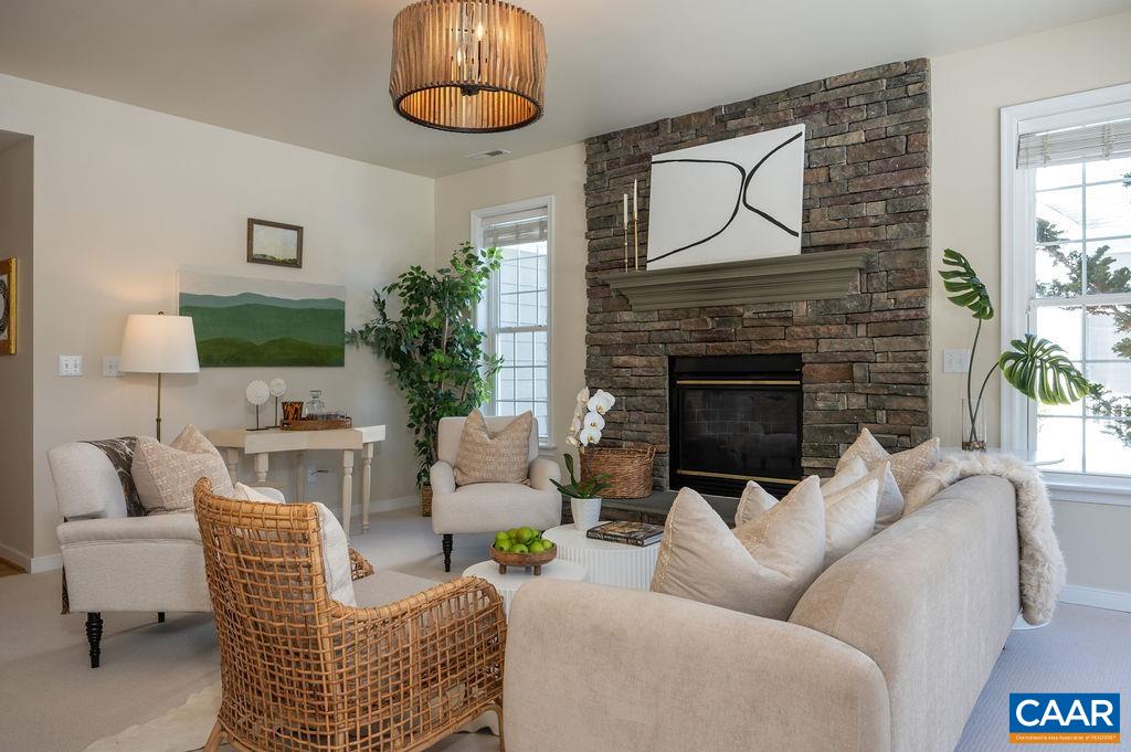 732 Russet Road Crozet, VA 22932 - Photo 17 of 48 a living room with furniture a fireplace and next to a window