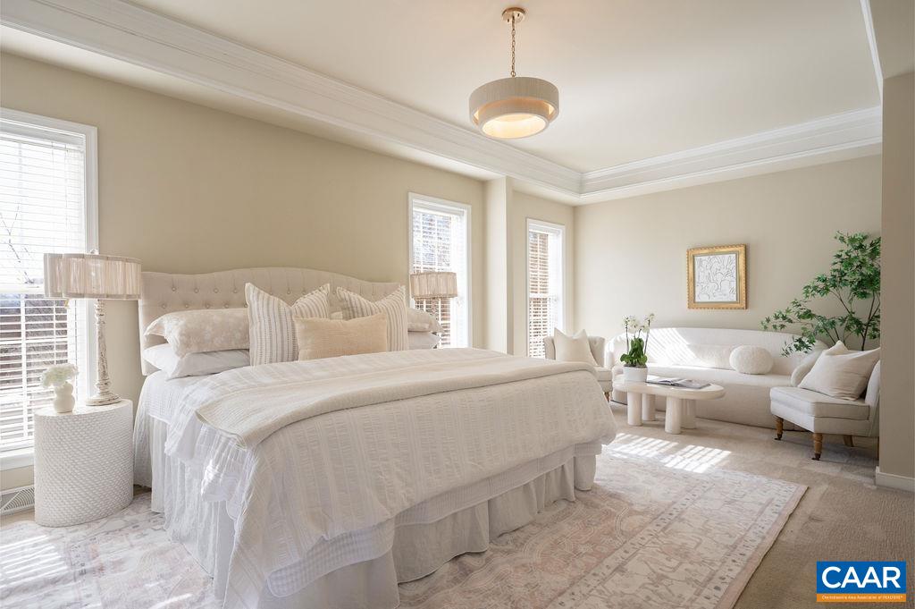 732 Russet Road Crozet, VA 22932 - Photo 26 of 48 a spacious bedroom with a bed and glass windows