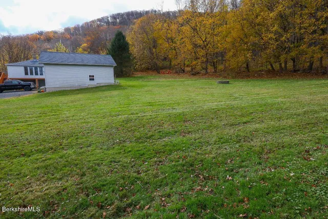 a view of a house with a big yard