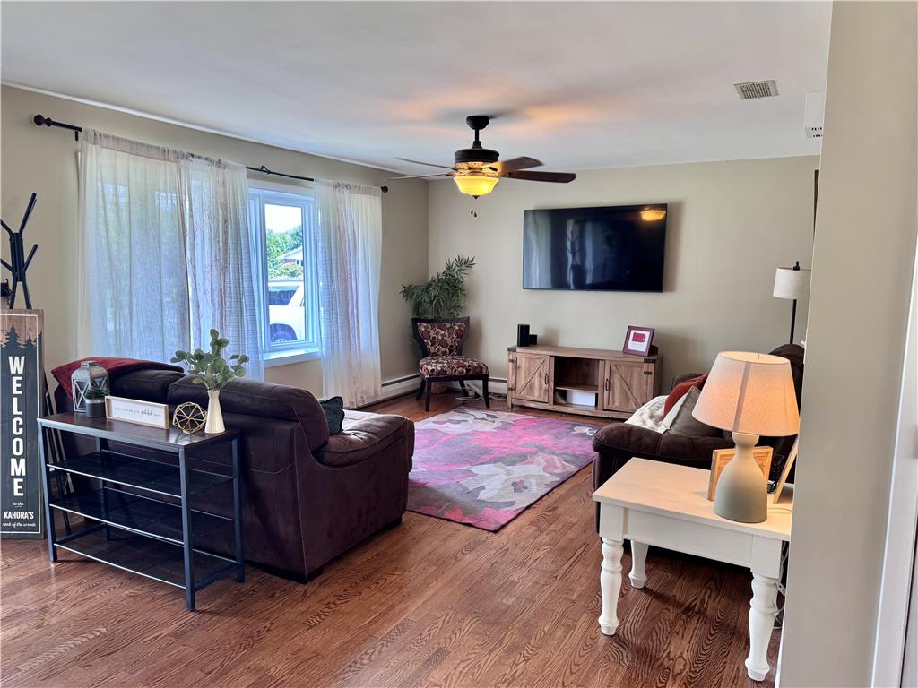5334 Egypt Road Laurys Station, PA 18059 - Photo 7 of 55 Rich hardwood flooring complements a comfortable, well-lit living area.